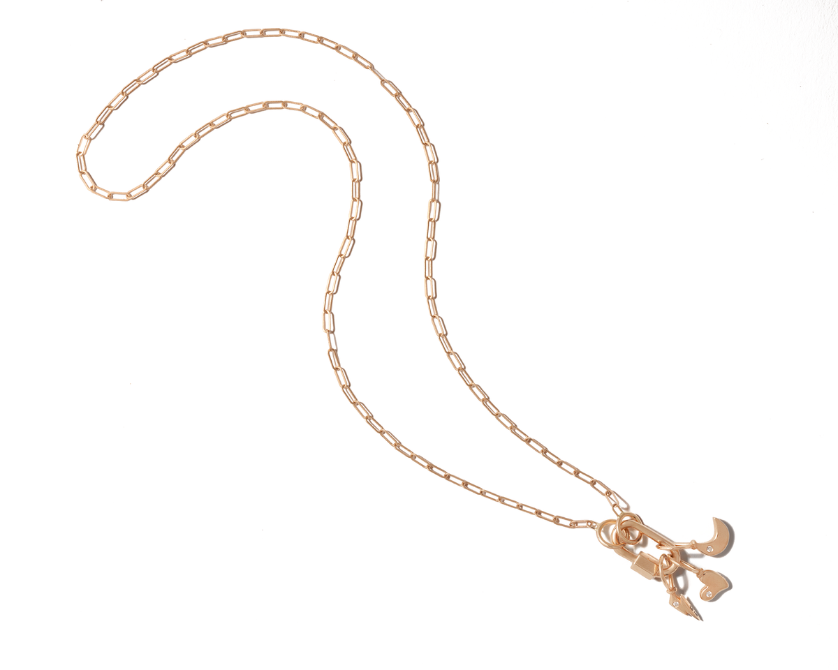 Gold necklace with multiple tiny gold charms for necklace