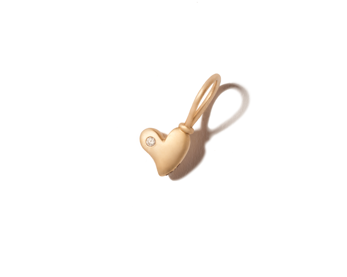 Tiny gold heart charm