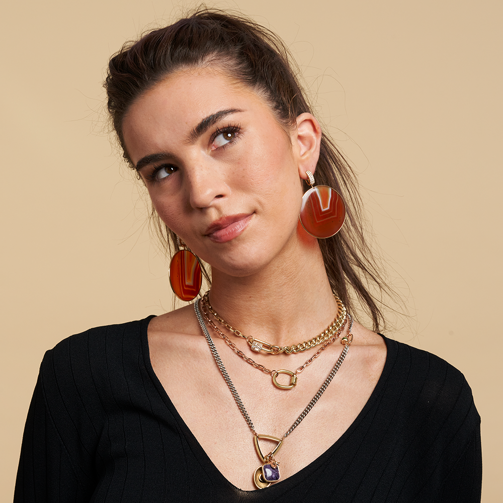 Woman wearing thick curb chain necklace
