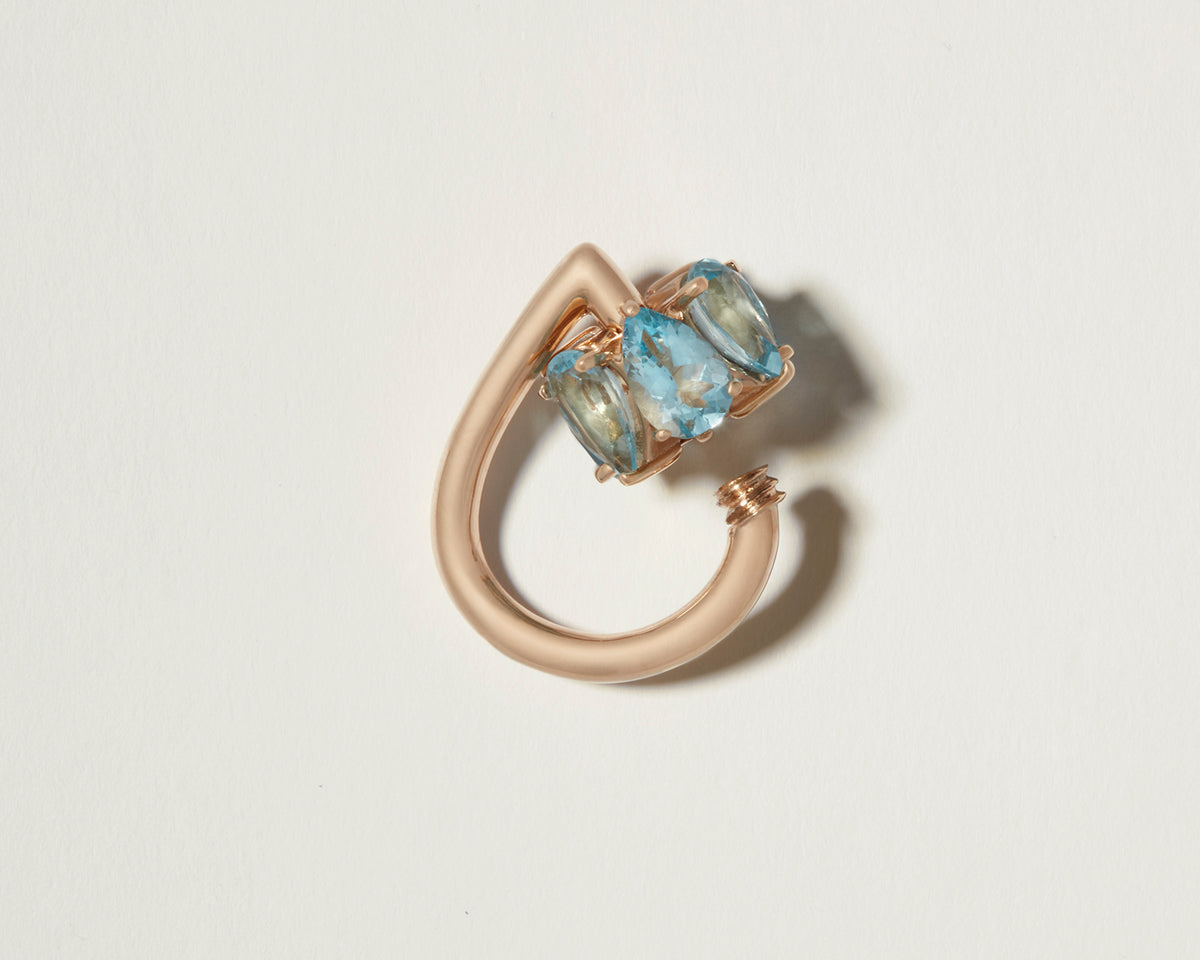 Gold droplock charm with open blue gemstone clasp