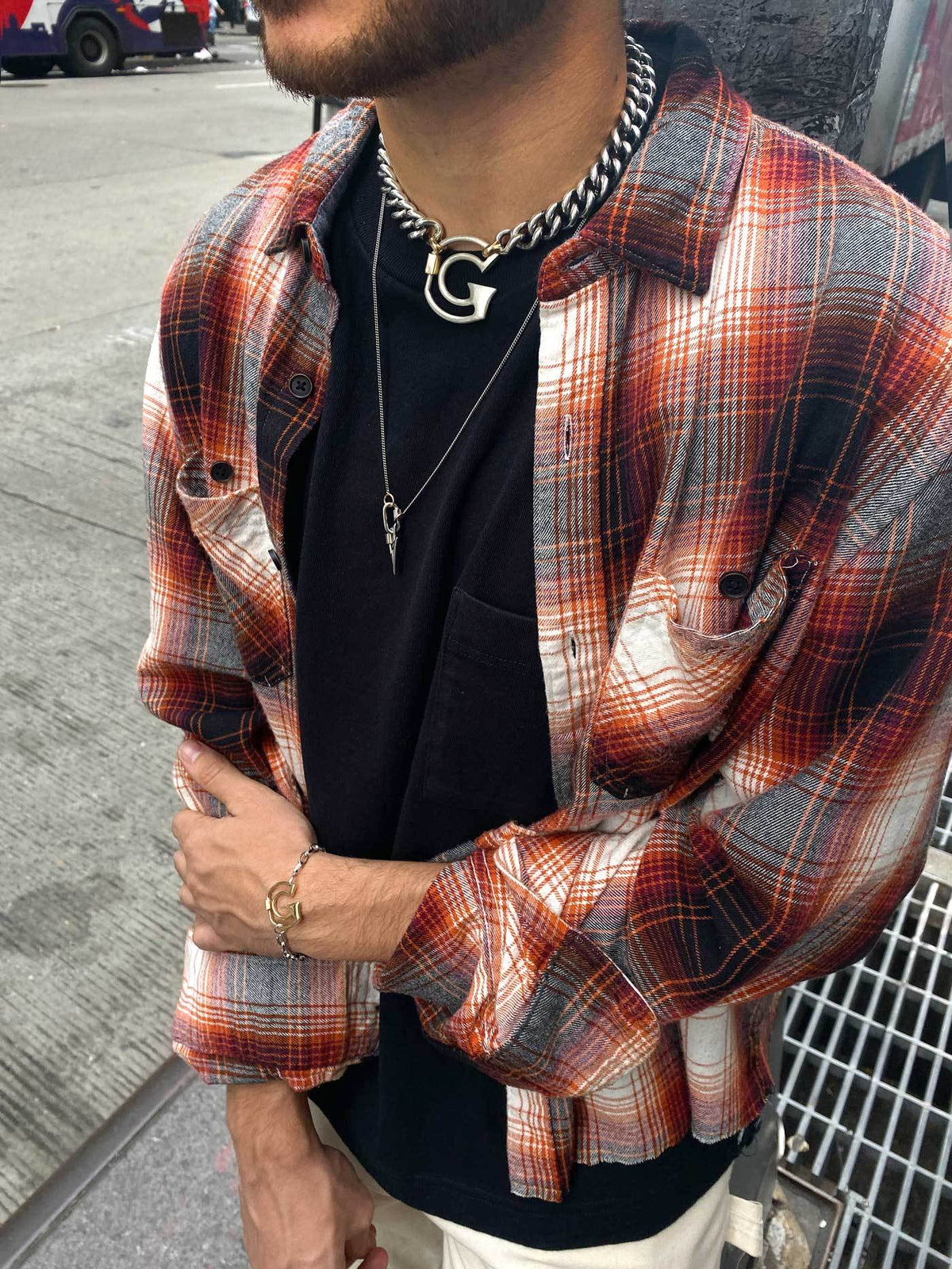 Man wearing necklace with G lock