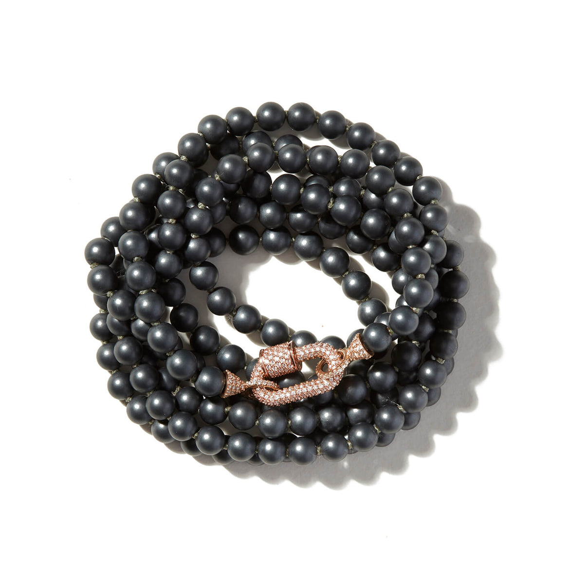 Curled up hematite crystal necklace with stoned rose gold lock