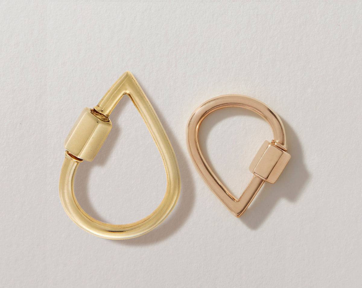 Large yellow gold droplock alongside rose gold small droplock